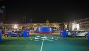 سيارات نيسان تتنافس خلال مباريات كرة قدم للسيارات في معرض دبي الدولي للسيارات